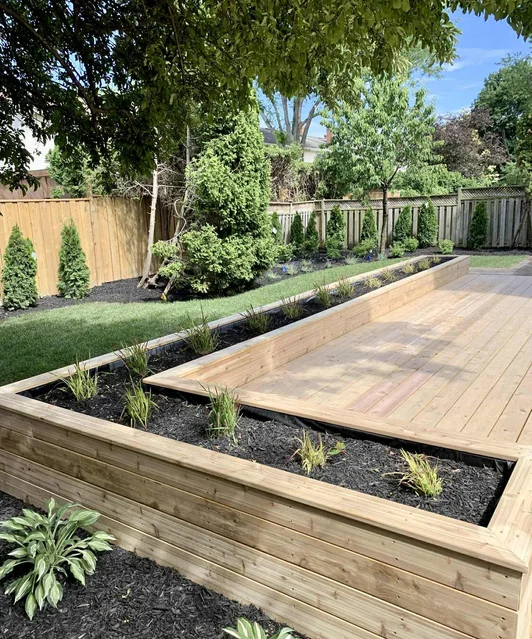 Custom cedar deck and fenced backyard — premium landscaping by Next Vision Construction